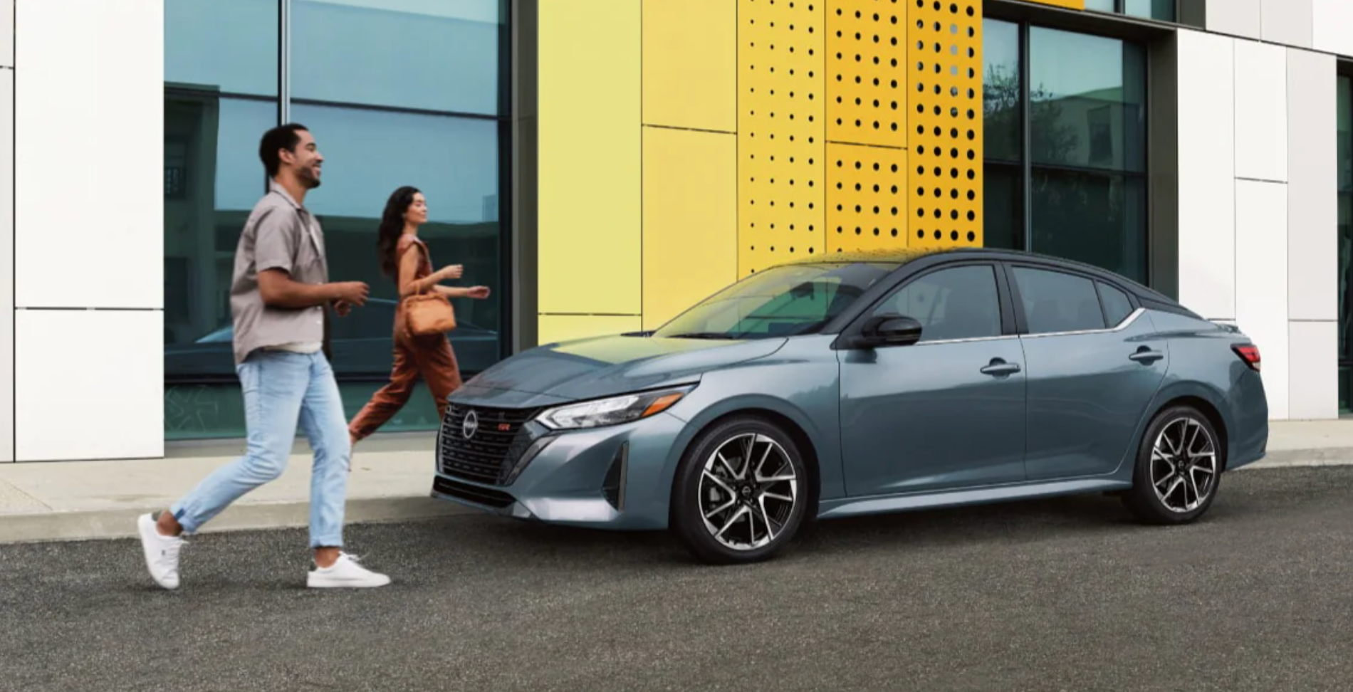 People walking up to a 2025 Nissan Sentra